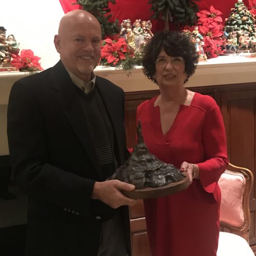 Sculptor David Biehl presenting Rhonda Seacrest her Chimney Rock sculpture